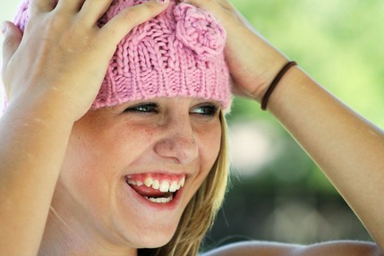 Girl smiling with pink hat